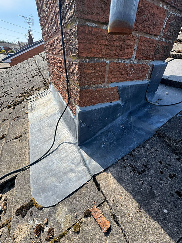 Lead flashing around chimney base